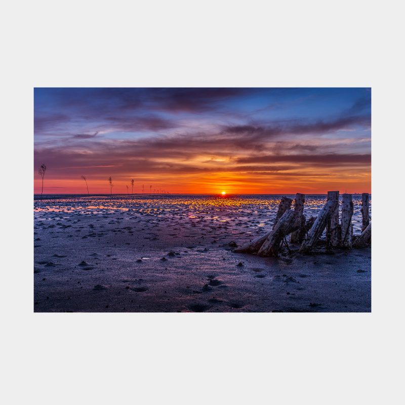 Solen forsvinder ned i Vadehavet nær Mandø